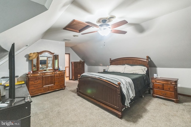 carpeted bedroom featuring lofted ceiling, ceiling fan, and visible vents