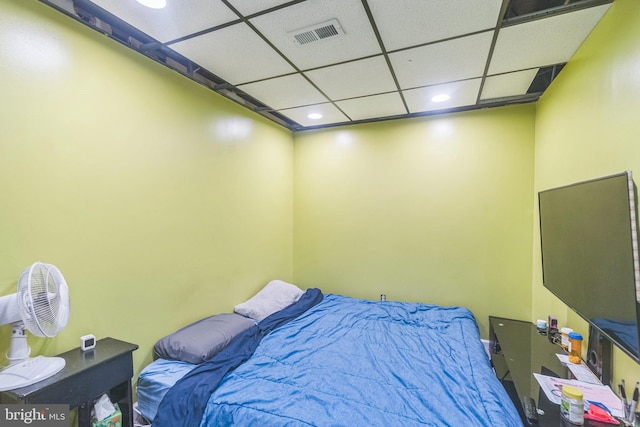 bedroom with recessed lighting, visible vents, and a drop ceiling