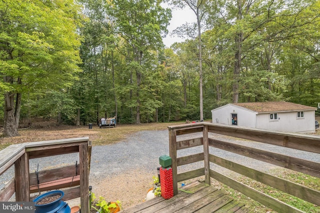 deck featuring an outdoor structure