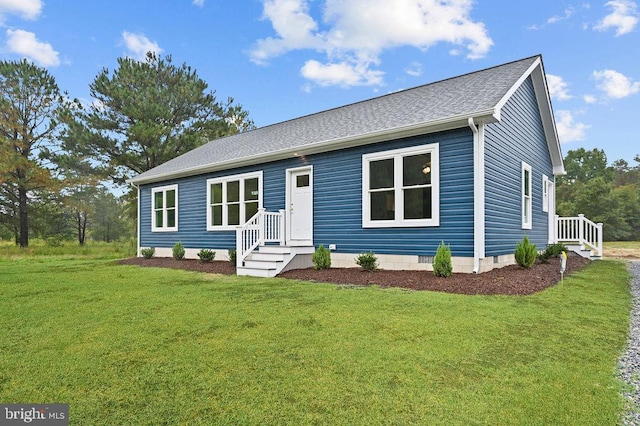 ranch-style house featuring crawl space, a shingled roof, and a front lawn