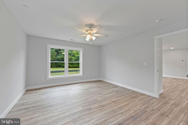 unfurnished room featuring light hardwood / wood-style floors and ceiling fan