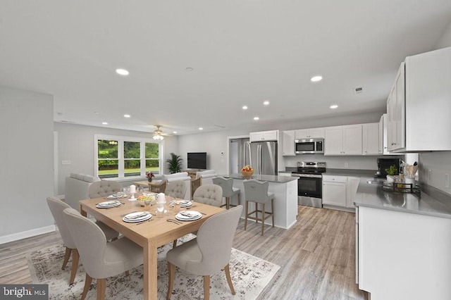 dining room featuring recessed lighting, visible vents, light wood-style floors, ceiling fan, and baseboards