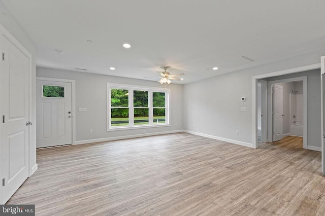 unfurnished living room with light wood-type flooring and ceiling fan