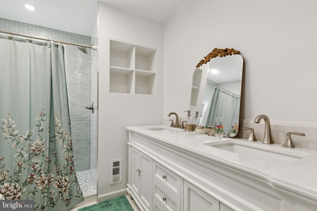 bathroom featuring a shower with curtain and vanity