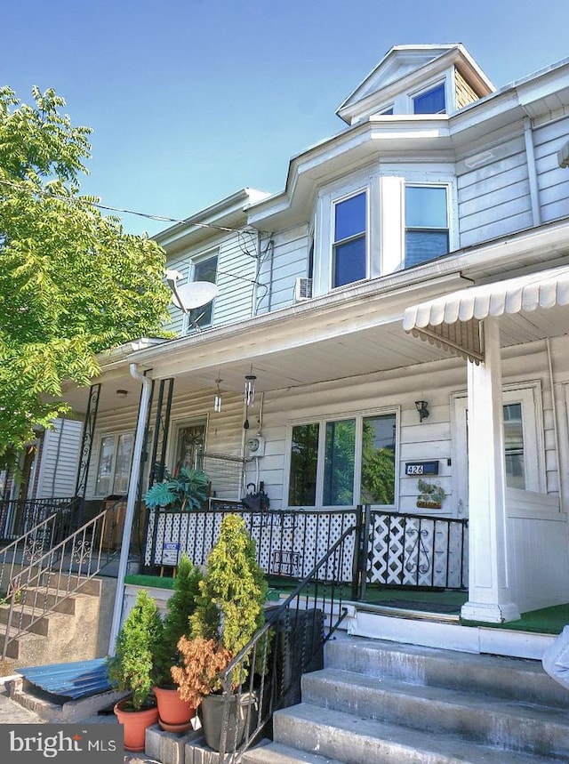 view of property featuring a porch