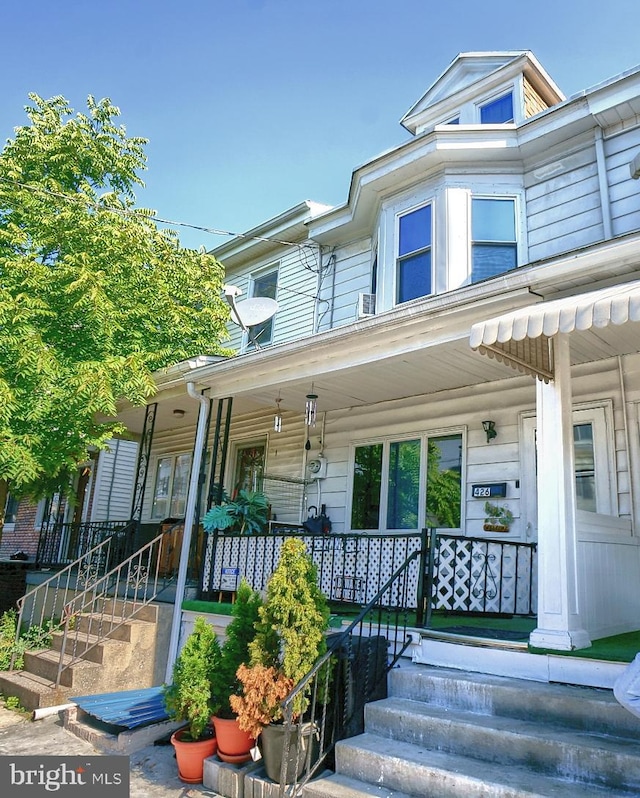 multi unit property featuring a porch