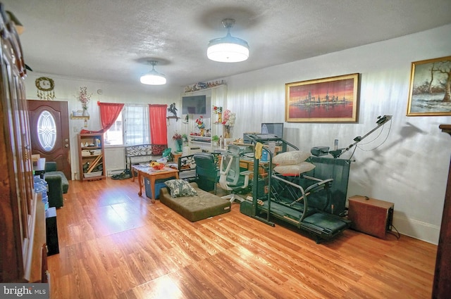 living room featuring a textured ceiling and hardwood / wood-style floors