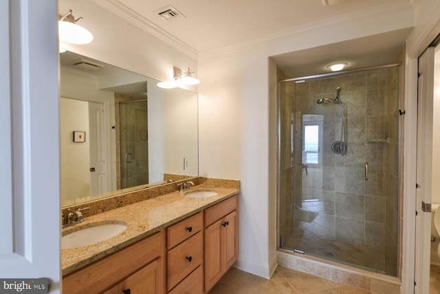 bathroom featuring tile patterned floors, walk in shower, crown molding, and vanity