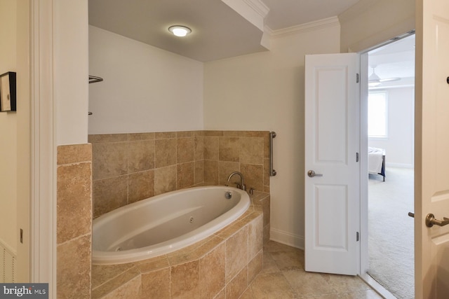 bathroom with tiled tub, ornamental molding, ceiling fan, and tile patterned floors