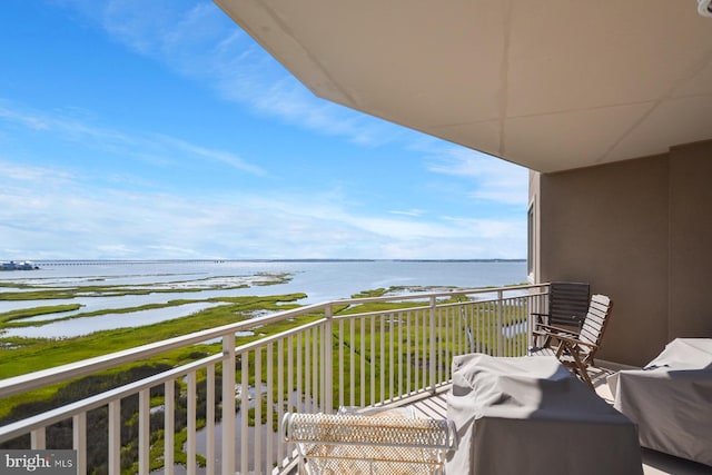 balcony featuring a water view