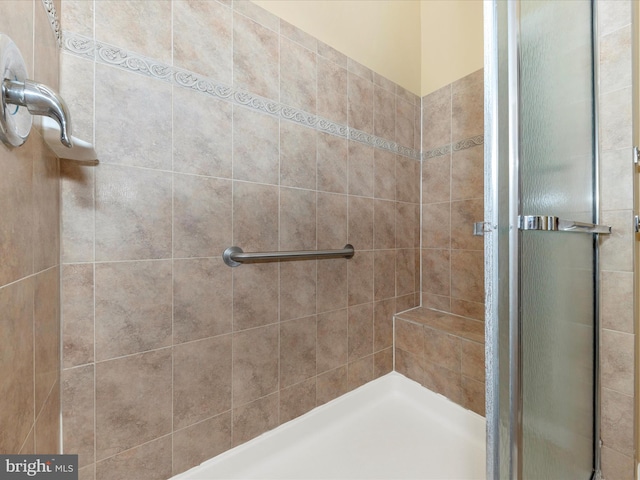 bathroom with an enclosed shower