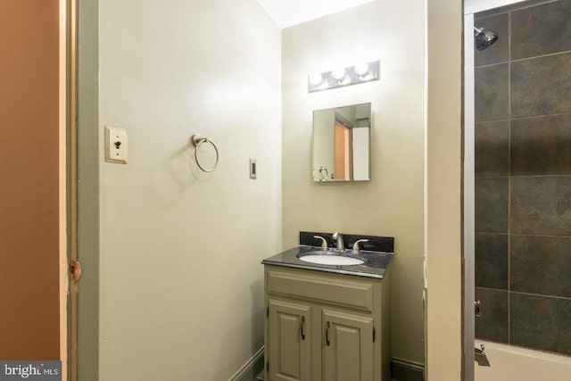 bathroom featuring shower / bath combination and vanity