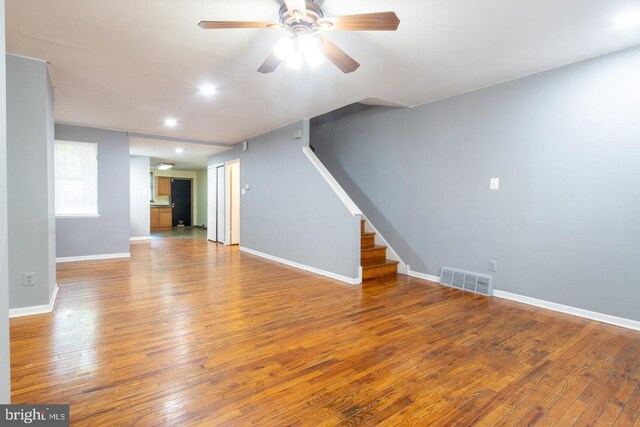 unfurnished room with ceiling fan and wood-type flooring