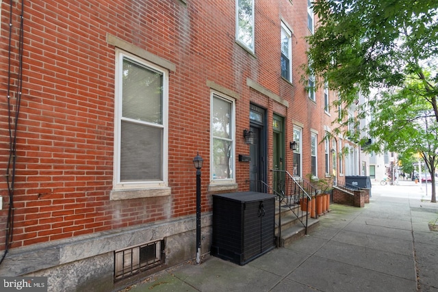 exterior space featuring brick siding