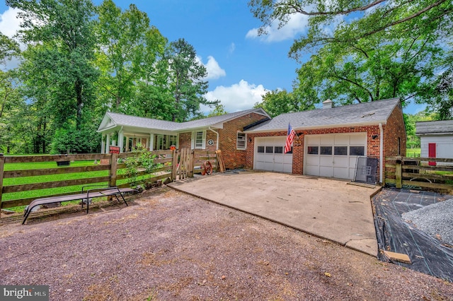 ranch-style house featuring a garage