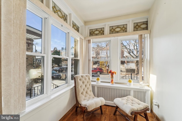 sunroom / solarium with radiator heating unit and a healthy amount of sunlight