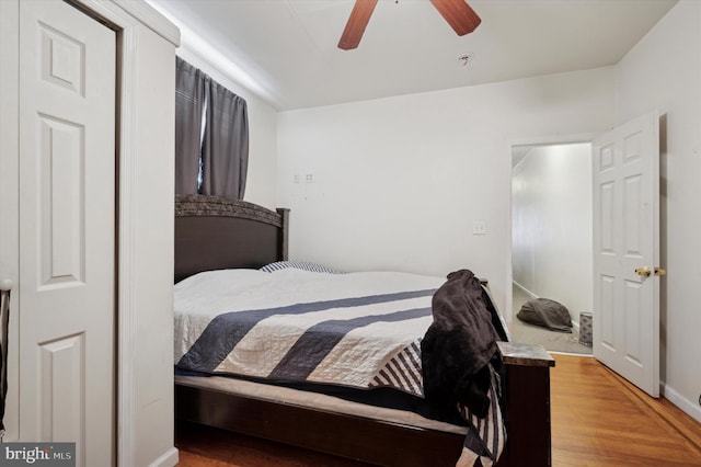 bedroom with hardwood / wood-style flooring and ceiling fan