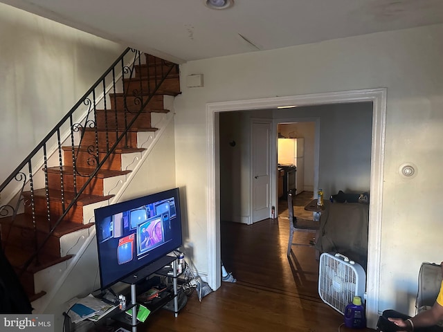 staircase with wood finished floors