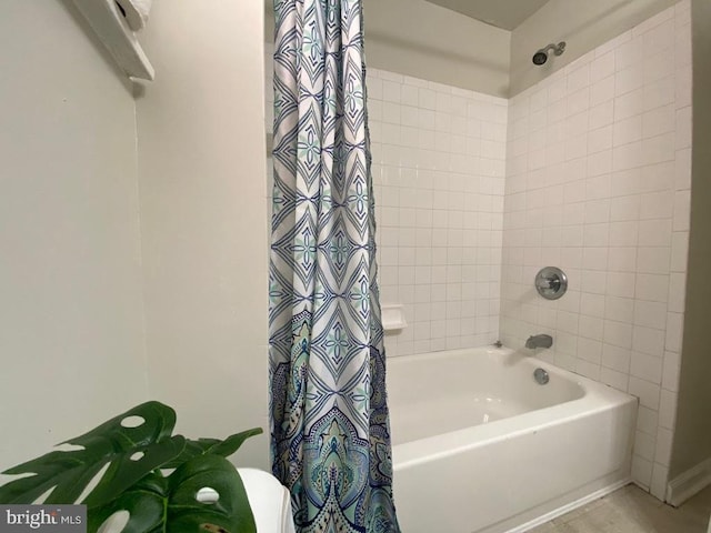 bathroom with shower / bathtub combination with curtain