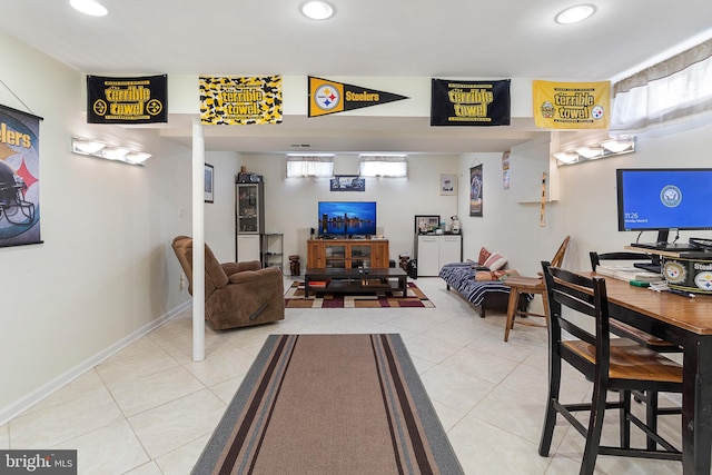 tiled living area featuring recessed lighting and baseboards