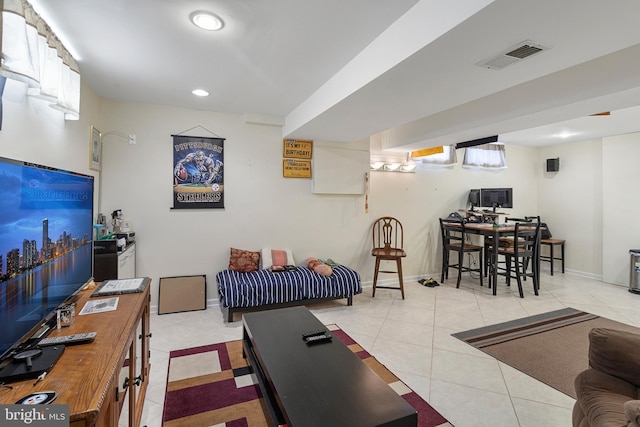 living room featuring light tile patterned floors, baseboards, visible vents, and recessed lighting