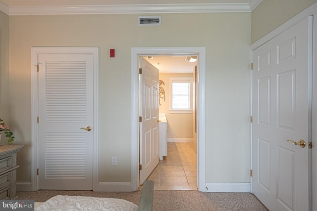 tiled bedroom with crown molding