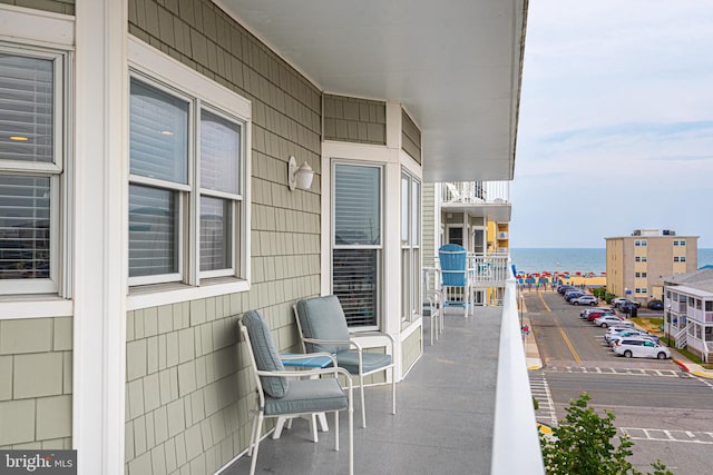 balcony featuring a water view