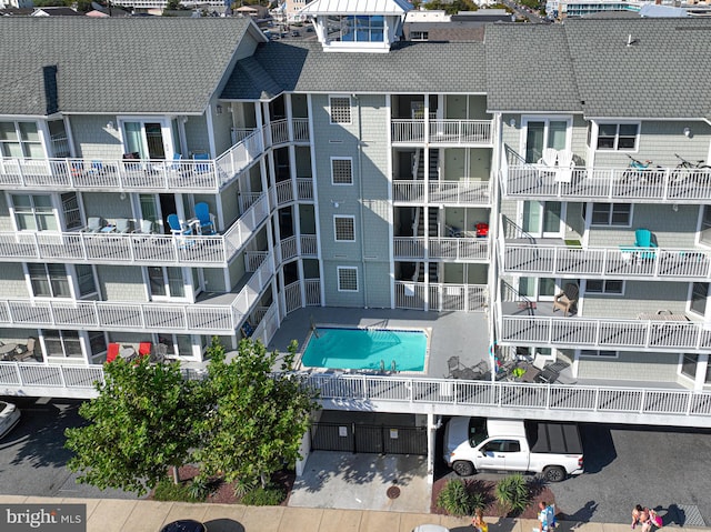 view of building exterior with a community pool