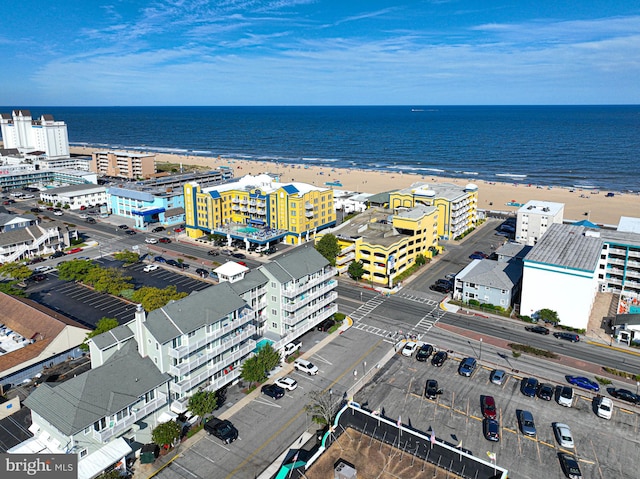 bird's eye view with a beach view and a water view