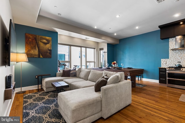 living room featuring billiards and dark hardwood / wood-style flooring