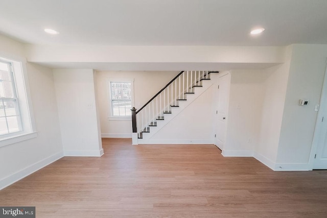 foyer entrance featuring light hardwood / wood-style floors and a healthy amount of sunlight