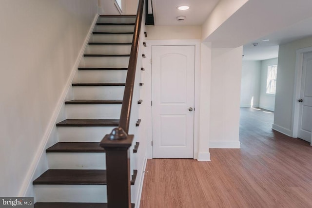 stairway with wood-type flooring