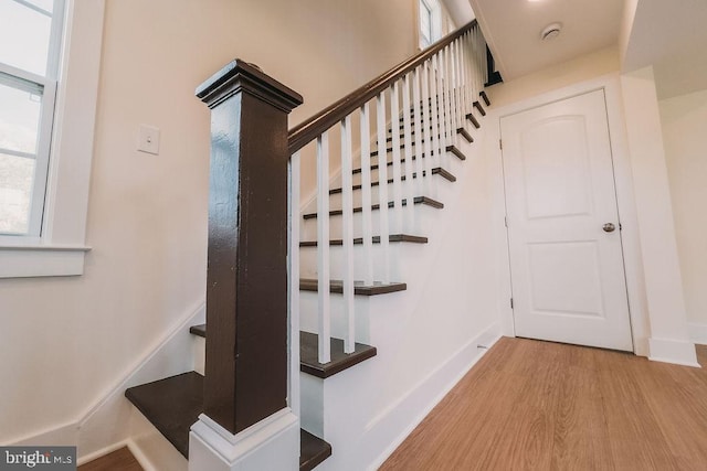 stairway featuring hardwood / wood-style floors