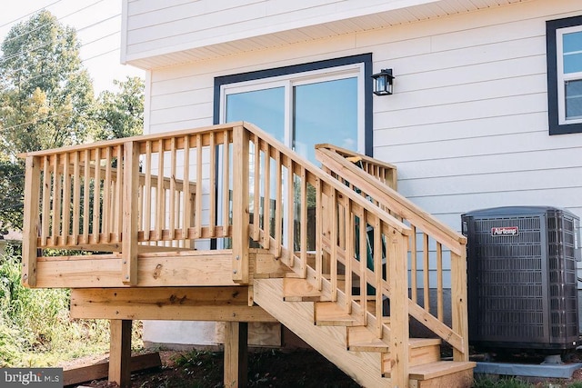 wooden deck with central air condition unit