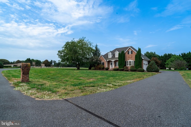 view of front of home featuring a front lawn