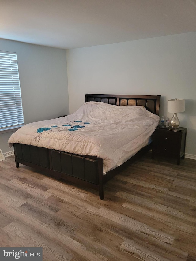 bedroom with hardwood / wood-style floors