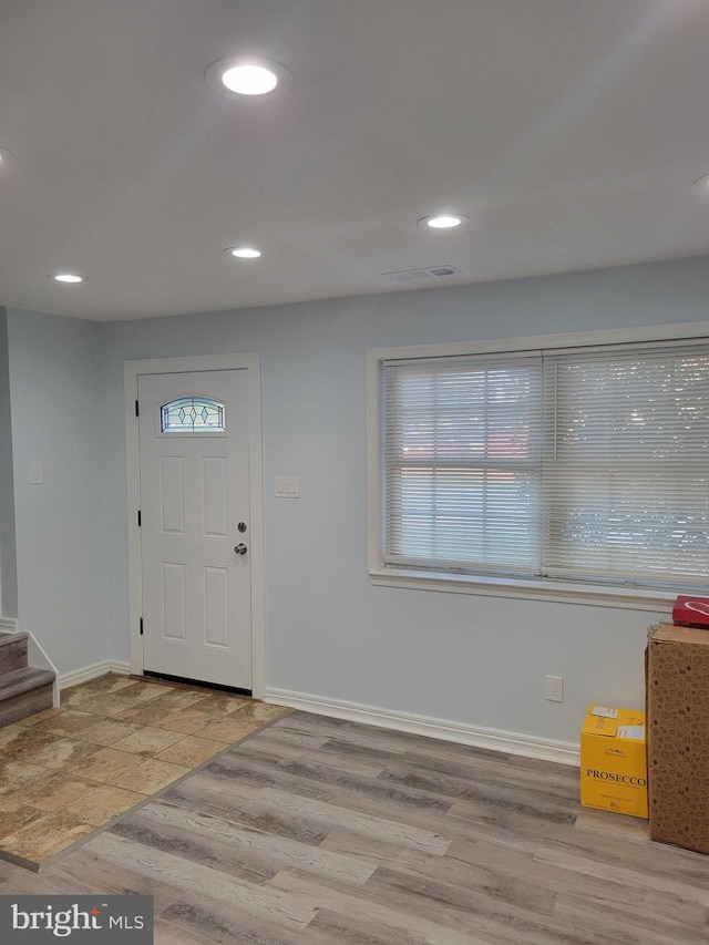 entrance foyer with light hardwood / wood-style flooring