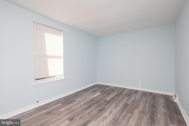 empty room featuring hardwood / wood-style flooring