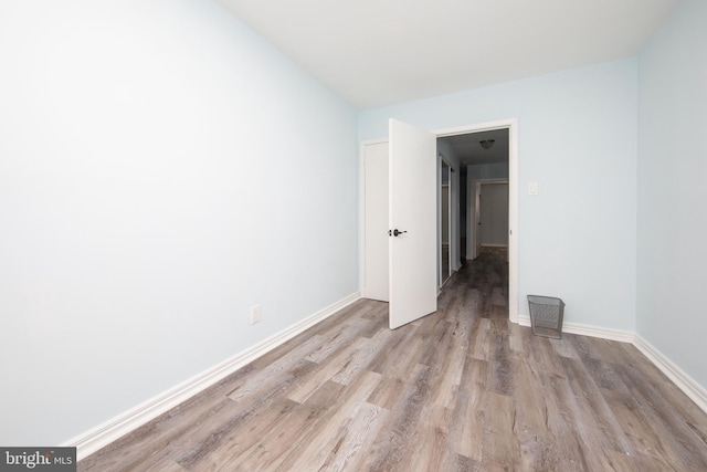 unfurnished room featuring light wood-type flooring