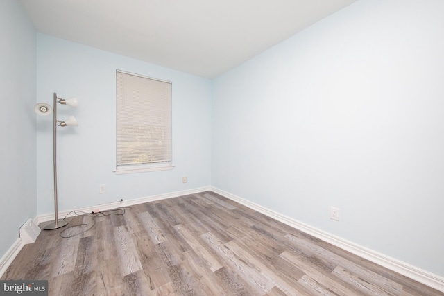 unfurnished room featuring light hardwood / wood-style floors