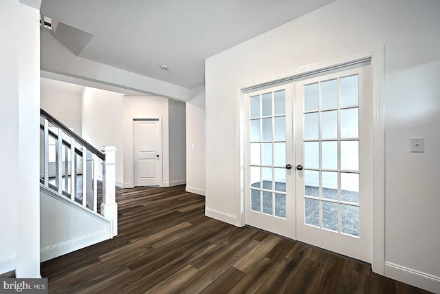 entryway with french doors, baseboards, dark wood finished floors, and stairs