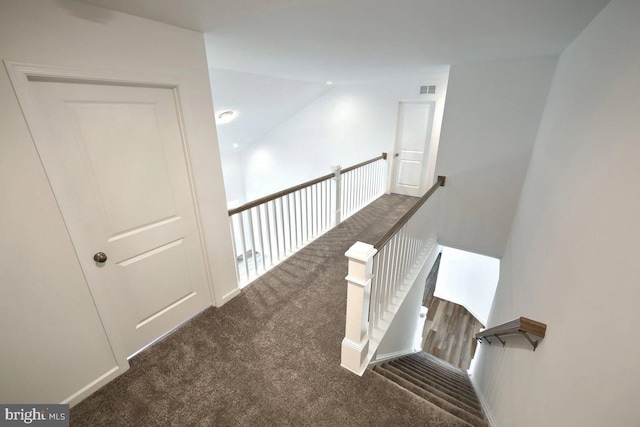 staircase with visible vents and carpet