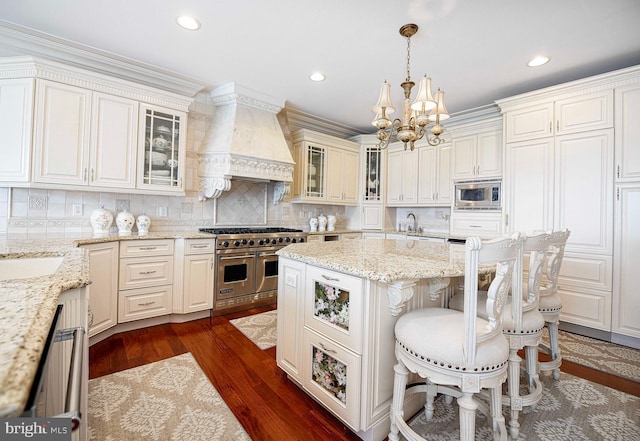 4116 Harford Creamery Rd, White Hall, MD 21161 - kitchen with a center island, custom exhaust hood, an inviting chandelier, a breakfast bar, and stainless steel appliances
