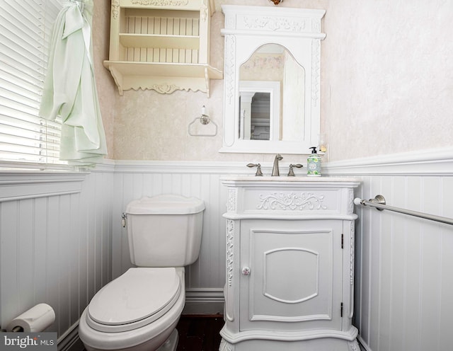 bathroom featuring vanity, toilet, and hardwood / wood-style flooring