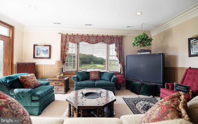 living room featuring a healthy amount of sunlight, ornamental molding, and light carpet