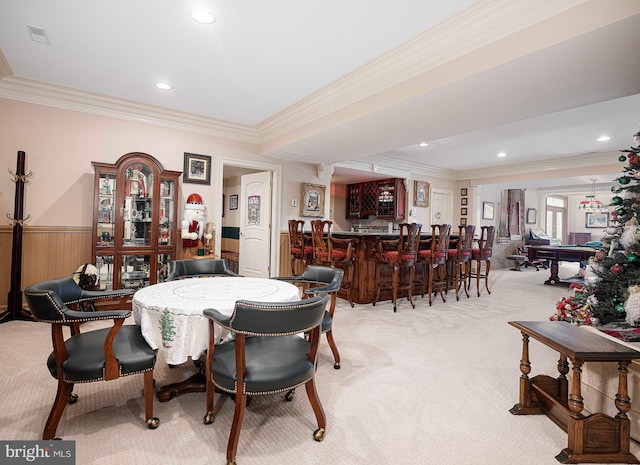 dining space featuring light carpet and ornamental molding