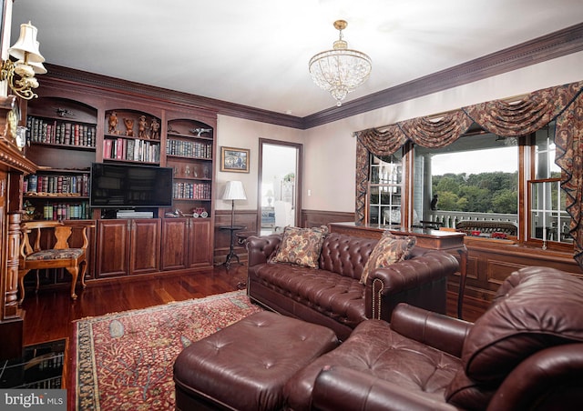 living room featuring a notable chandelier, ornamental molding, and dark wood-type flooring