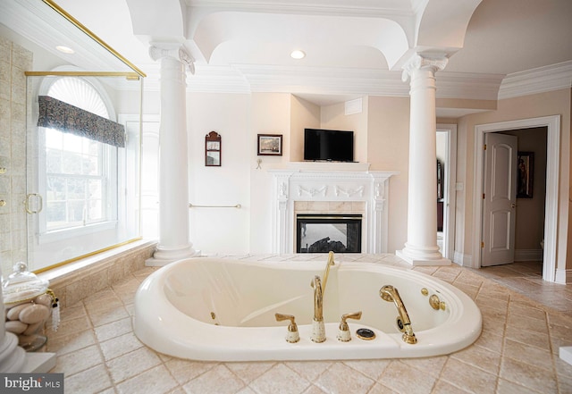 bathroom with independent shower and bath, a multi sided fireplace, and decorative columns