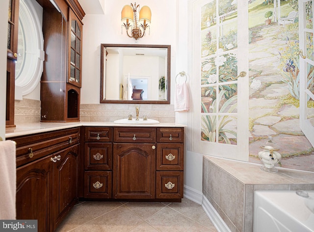 bathroom with vanity, backsplash, and tile patterned floors