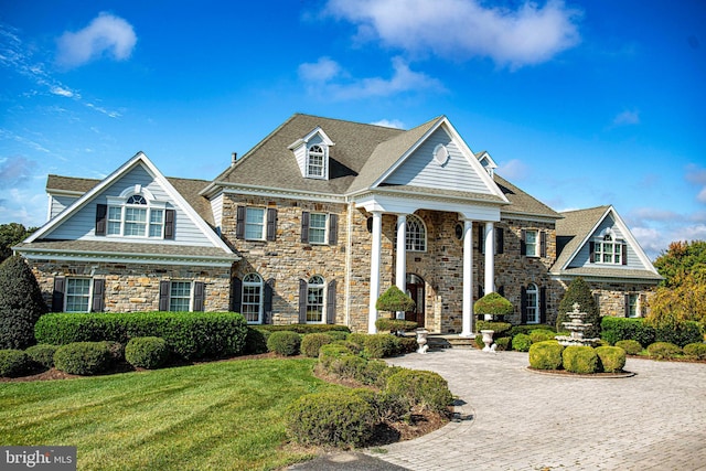 view of front of home with a front lawn